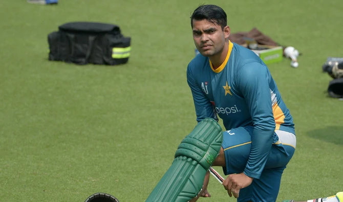 In this file photo, Pakistan's Umar Akmal pads up he takes part in a training session ahead of the World T20 cricket tournament match at The Eden Gardens Cricket Stadium in Kolkata on March 13, 2016. (DIBYANGSHU SARKAR/AFP)
