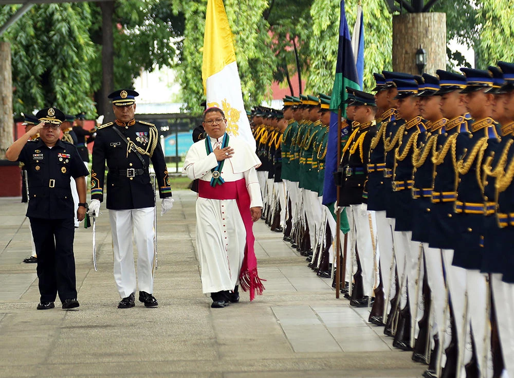 For Cebu Auxiliary Bishop Oscar Florencio, above, who is also the apostolic administrator of the Military Ordinariate of the Philippines, priests carrying weapons “will create more chaos” instead of solving problems. (AFP)