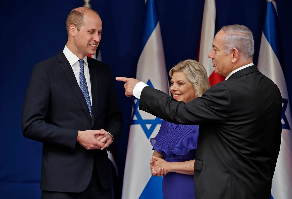 Britain's Prince William meets with Israeli Prime Minister Benjamin Netanyahu and his wife Sara on June 26, 2018 in Jerusalem. Britain's Prince William arrived in Israel the previous night, the first member of the royal family to make an official visit to the Jewish state and the Palestinian territories. (AFP)
