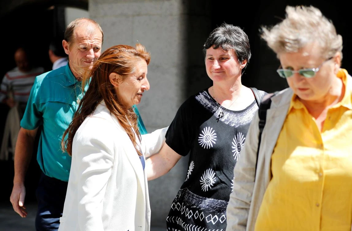 Parents of murdered French au-pair Sophie Lionnet, Catherine Devallonne (2R) and Patrick Lionnet (L) leave the Old Bailey, London’s Central Criminal Court, in central London on June 26, 2018 after hearing the sentence handed down to their daughter’s murderers. (AFP)