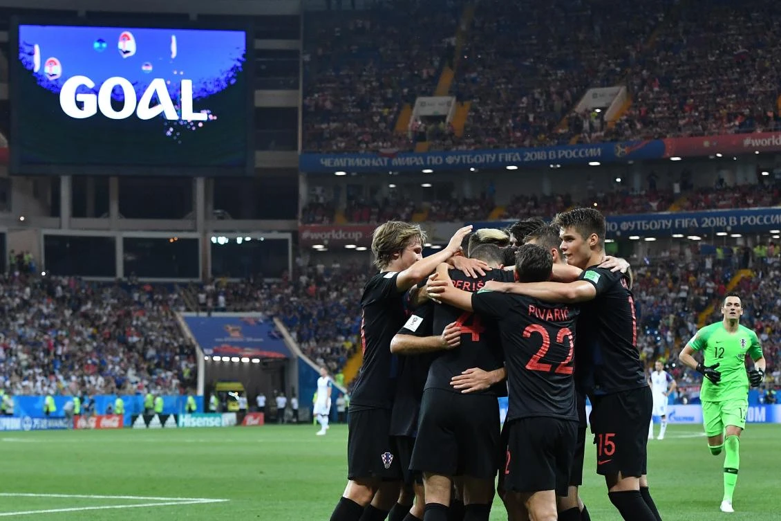 Ivan Perisic (4) is congratulated by teammates after scoring Croatia’s second goal in their 2 — 1 win over Iceland in Rostov-On-Don. (AFP)
