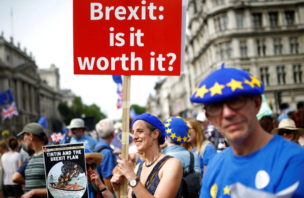 A woman holds a placard as she joins EU supporters calling on the government to give Britons a vote on the final Brexit deal on Saturday, June 23. British banks have enough capital and will not need any more to face any turbulence in markets if Britain leaves the EU next March without a deal, the government says. (Reuters)