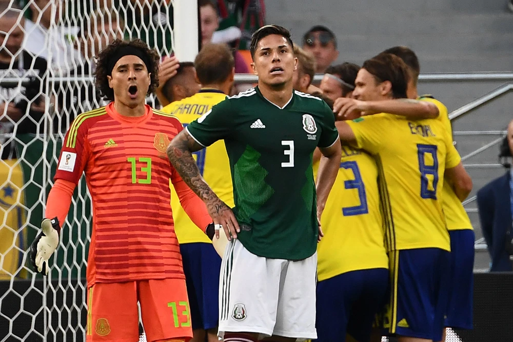 Mexico’s goalkeeper Guillermo Ochoa and Edson Alvarez, after the defender scored a bizarre own goal in their 3 — 0 loss to Sweden in Ekaterinburg. (AFP)