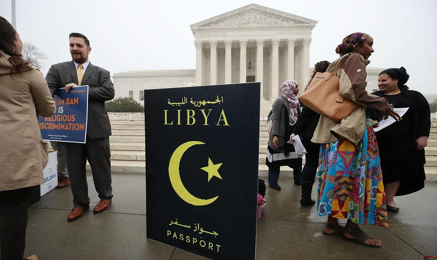 In this file photo taken on April 25, 2018 people gather to protest President Trump's travel ban in front of the US Supreme Court, in Washington, DC. (AFP)