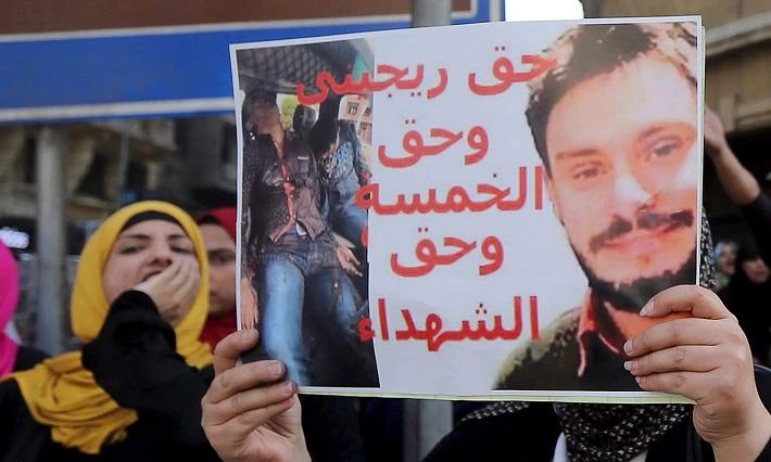 Giulio Regeni – seen here on a posted held by an Egyptian activist – was killed in late January or early February. Italian officials say Egypt is not serious about helping find his murderers. (Reuters)