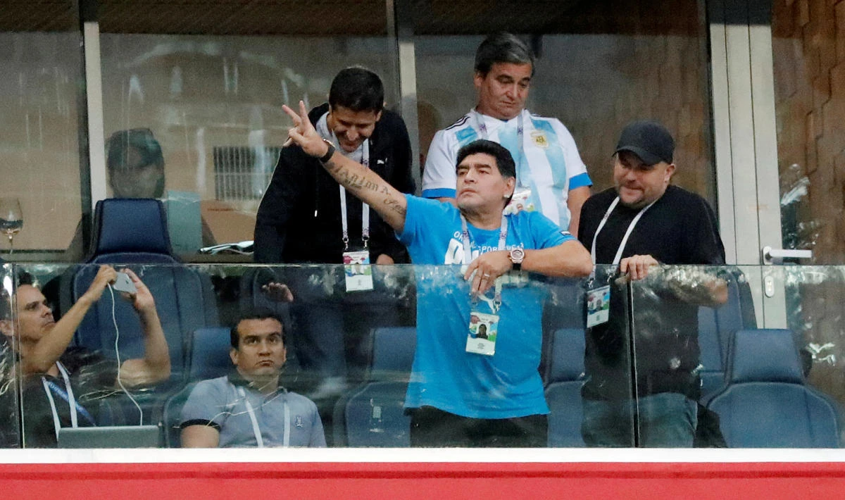 Diego Maradona salutes the fans during the match between Nigeria and Argentina in Saint Petersburg. WhatsApp voice messages, from a man with an Argentine accent, said the 57-year-old star had died of cardiac arrest after the match. (Reuters)