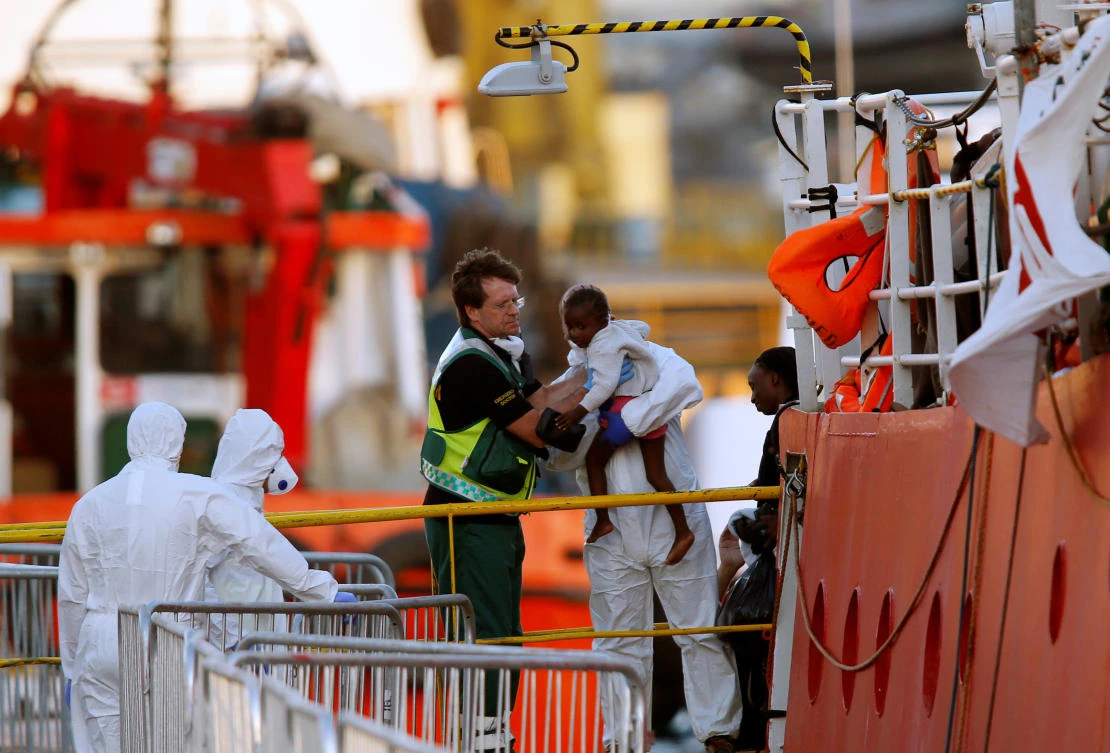 A migrant child is carried out from the charity ship Lifeline at Boiler Wharf in Senglea, in Valletta’s Grand Harbor, Malta June 27, 2018. (Reuters)