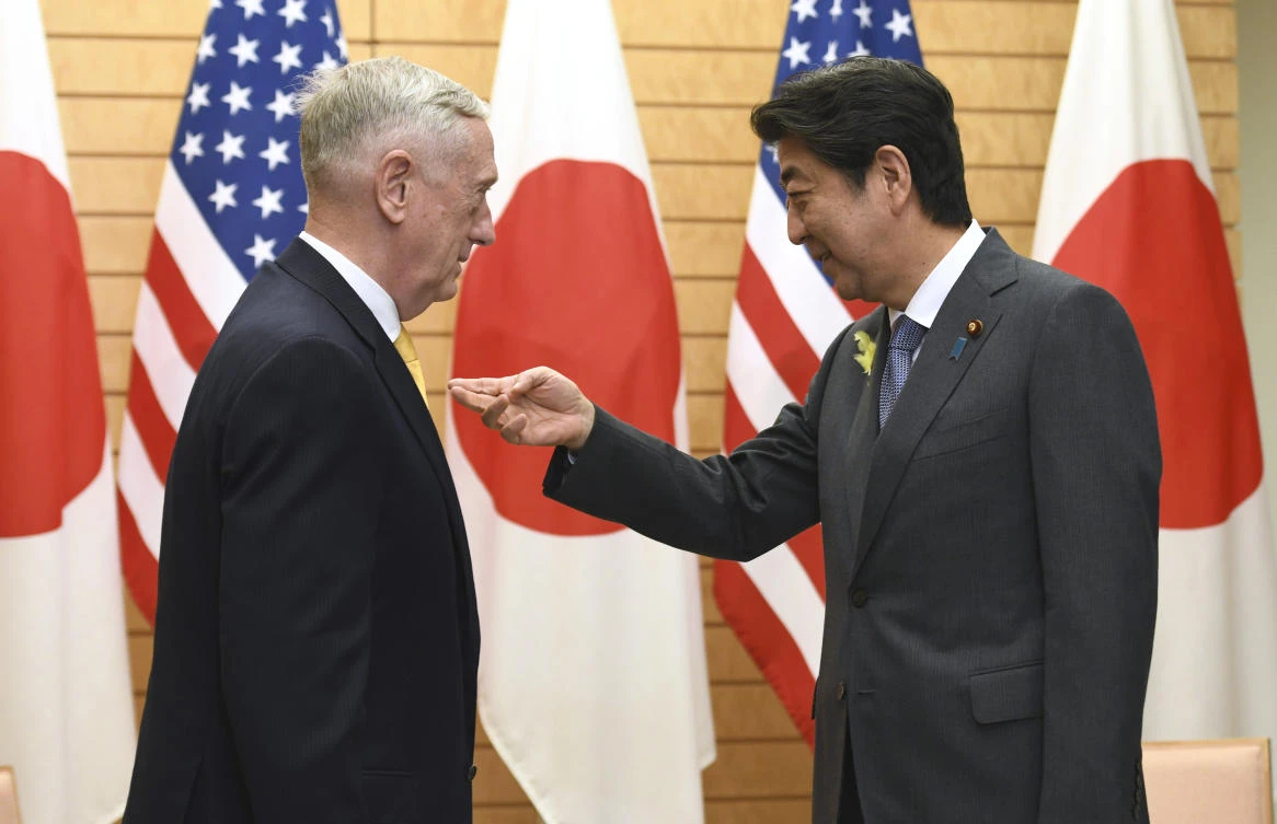 Japanese Prime Minister Shinzo Abe greets US Defense Secretary Jim Mattis before their meeting at Abe’s official residence on Friday. Abe could fend off demands from the US president to sign a bilateral trade agreement by offering to buy more oil. (AFP)
