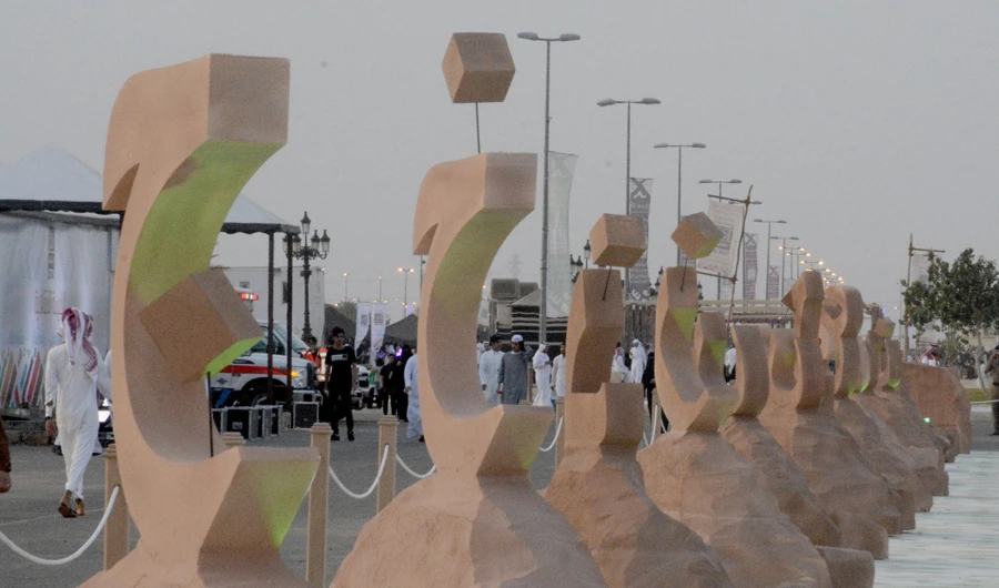 More than 50 artists took part in the creation of a 560-square-meter green mural at Souq Okaz. (SPA)