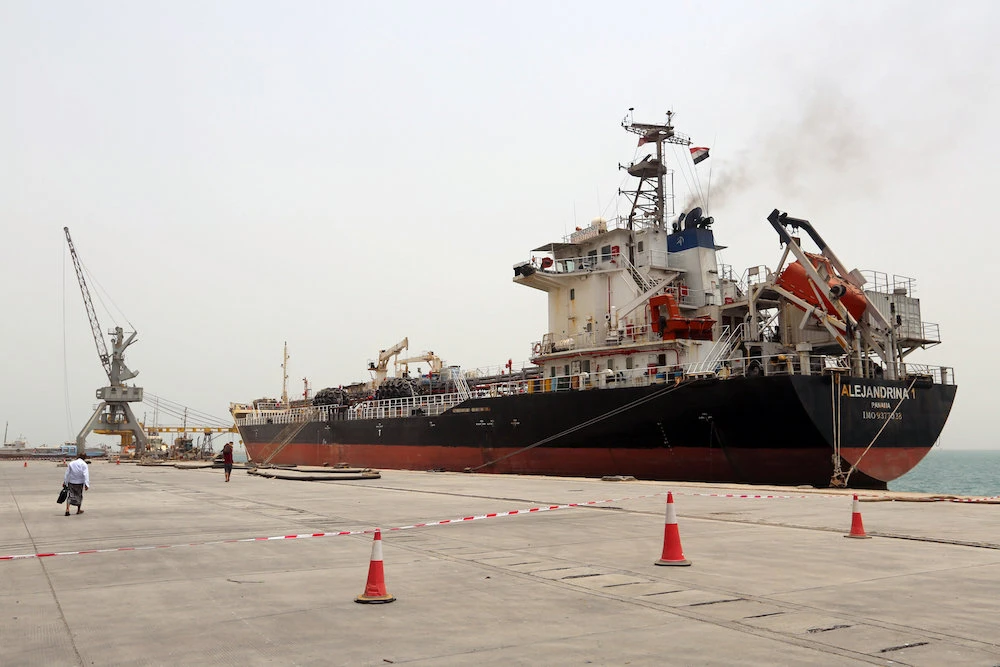 In this file photo, a man walks past a ship at the Red Sea port of Hodeidah. (Reuters)