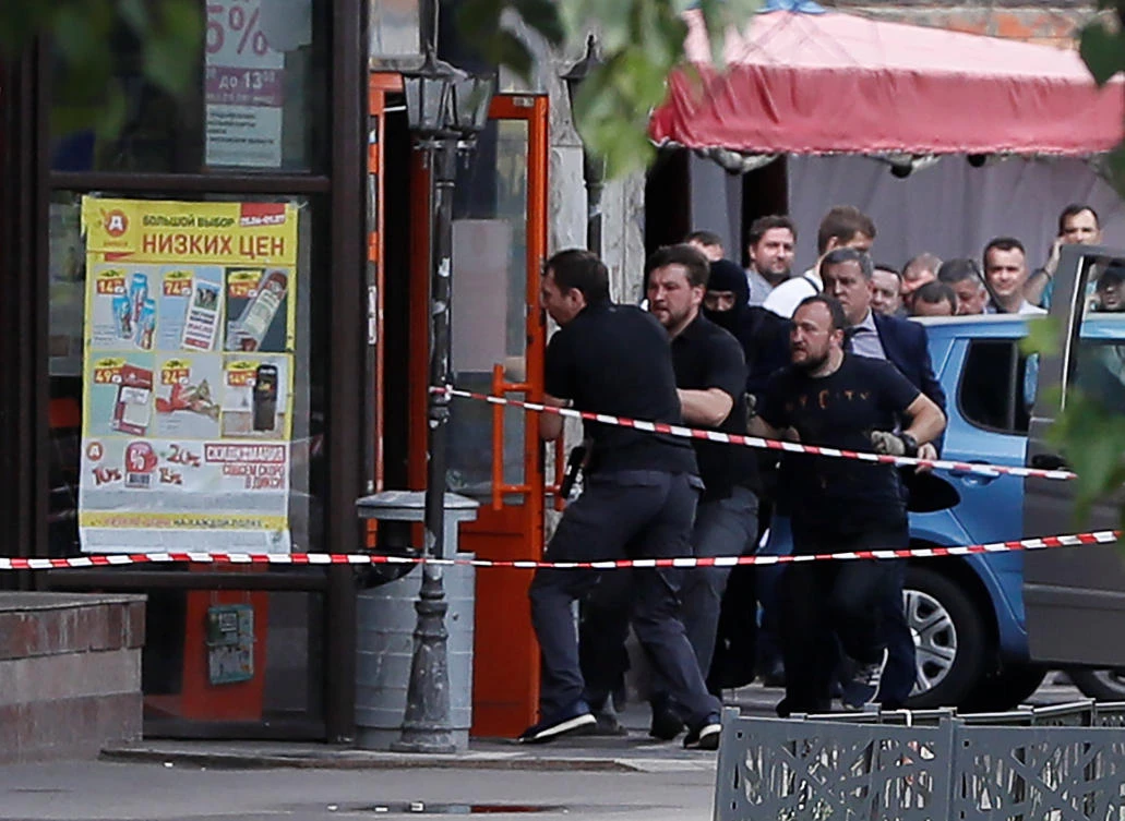 Members of a police special operations unit raid into a grocery store, operated by Russian food retailer Dixy Group, after an unidentified man reportedly took hostages in Moscow, a host city for the soccer World Cup, Russia July 1, 2018. (Reuters)