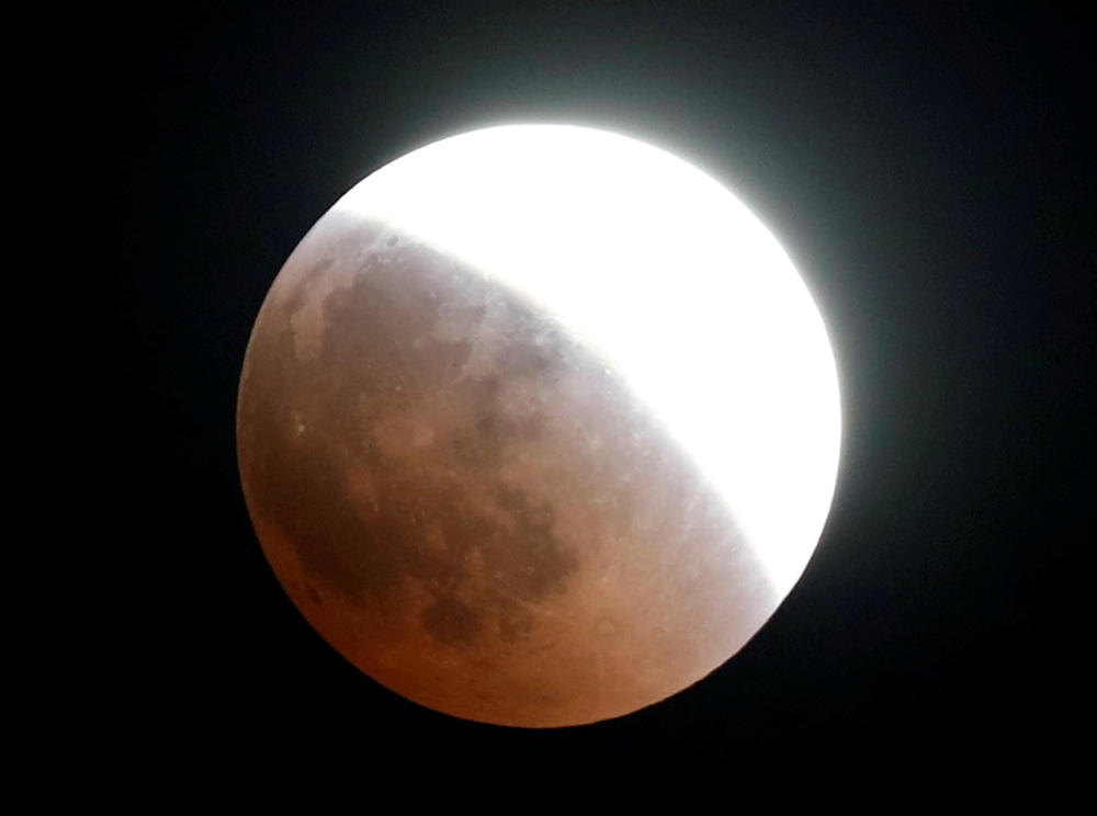 The moon is seen during a lunar eclipse over Cairo, Egypt July 27, 2018. (REUTERS/Amr Abdallah Dalsh)