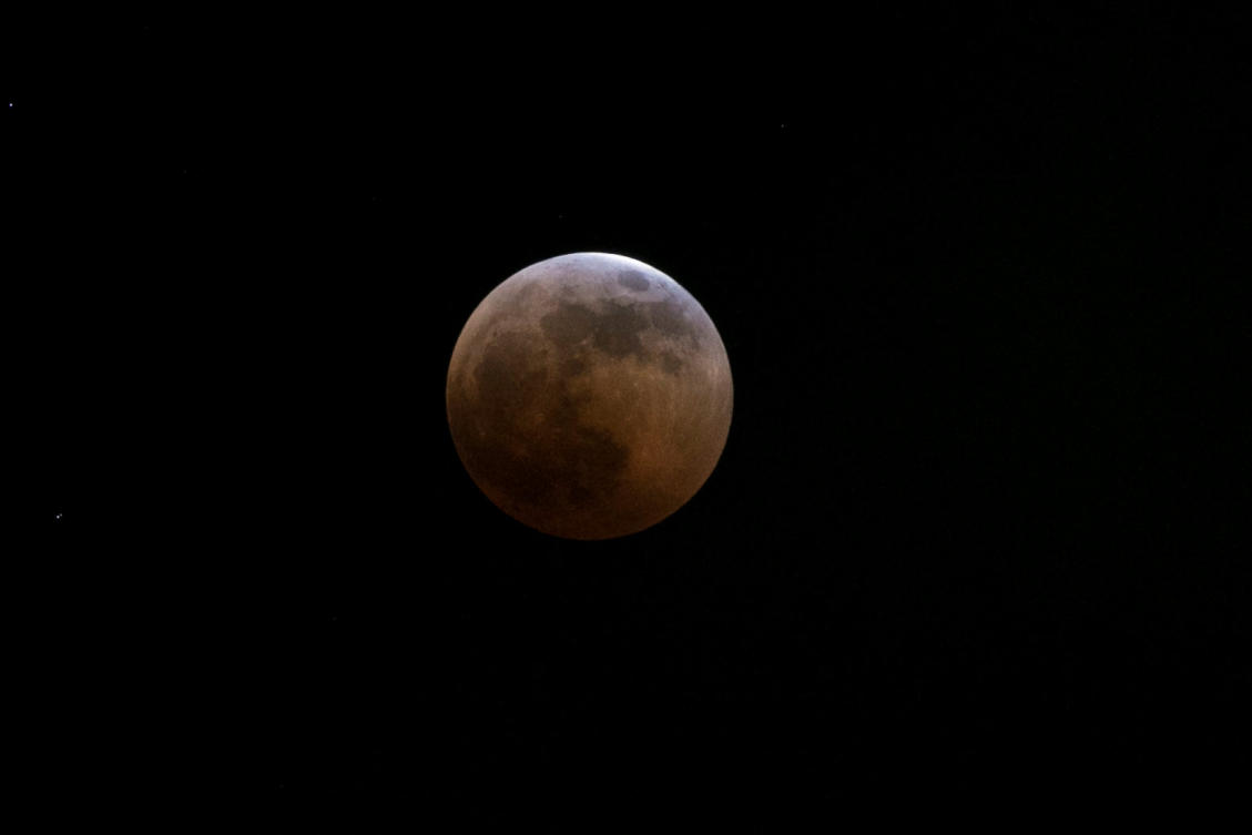 The moon is seen during a full lunar eclipse over Nairobi, Kenya, July 27, 2018. REUTERS/Baz Ratner