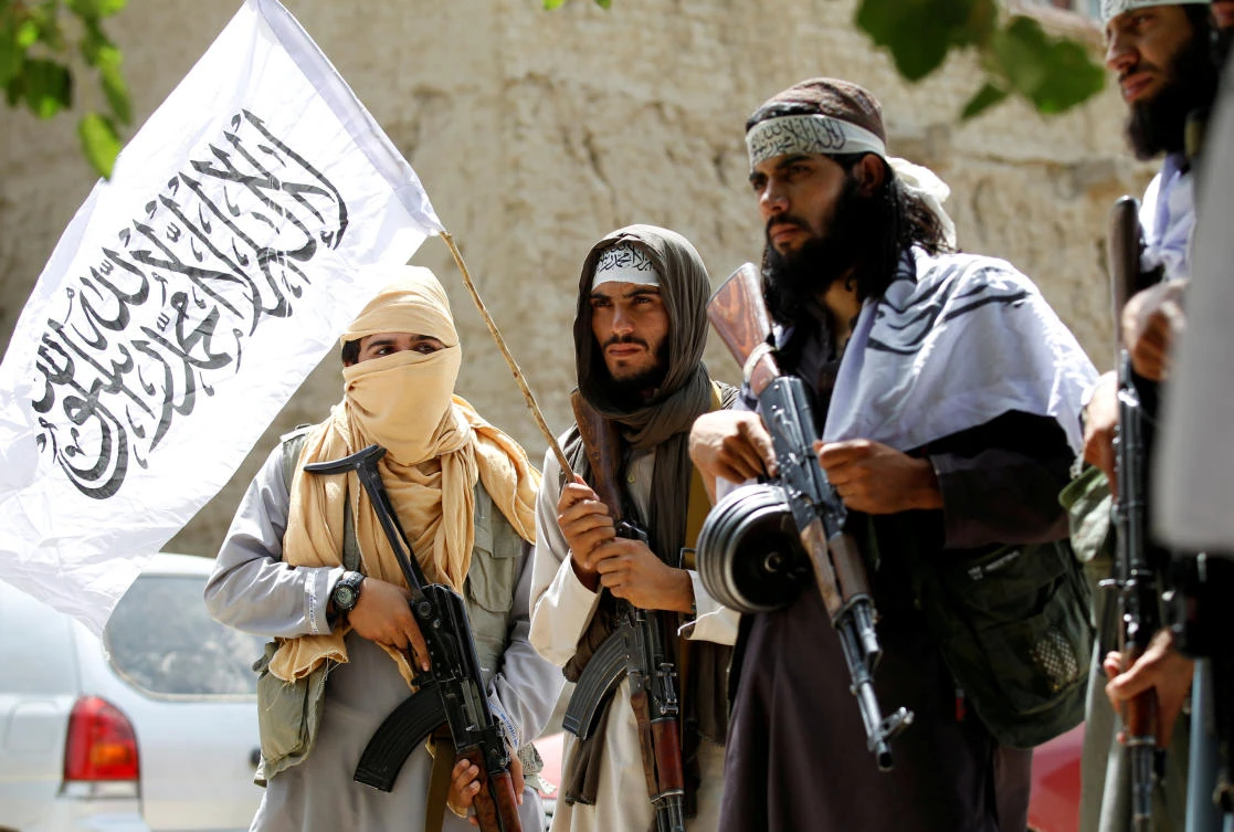 Taliban walk as they celebrate cease-fire in Ghanikhel district of Nangarhar province, Afghanistan June 16, 2018. (Reuters)