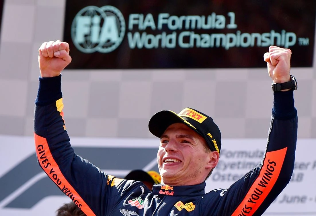 Red Bull's Dutch driver Max Verstappen celebrates on the podium after winning the Austrian Formula One Grand Prix. (AFP/ANDREJ ISAKOVIC)