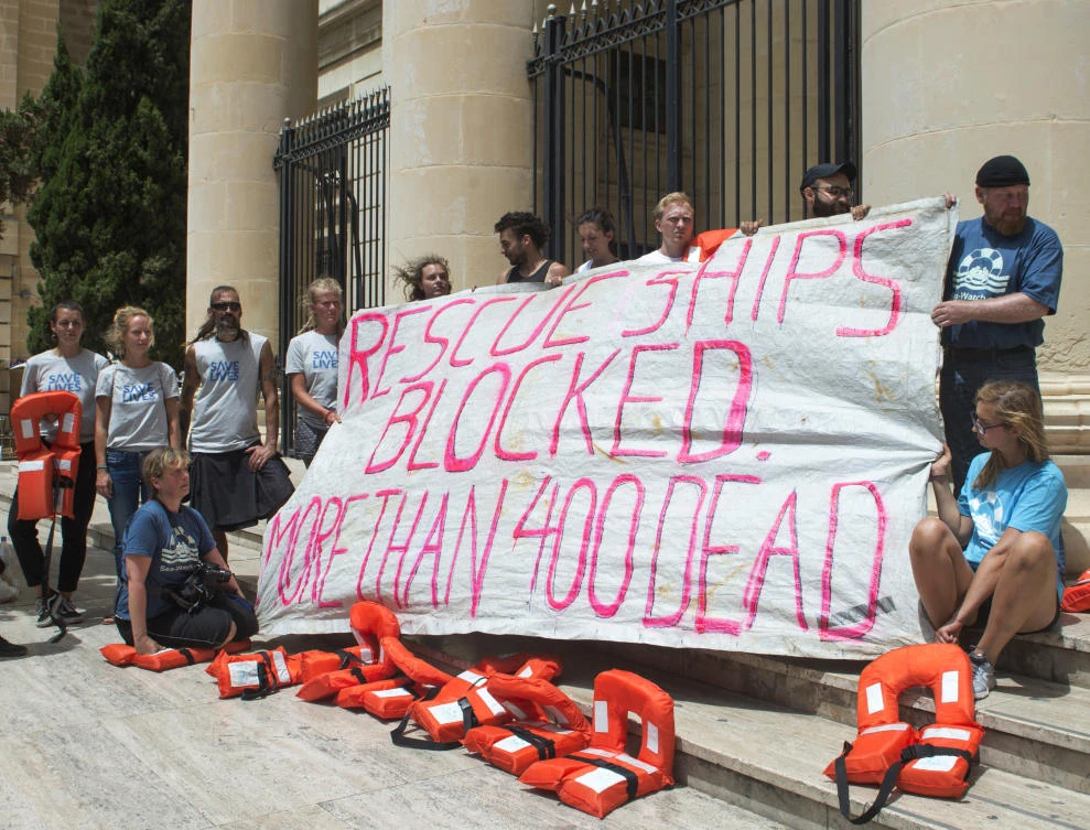 Members of Lifeline’s crew stage a protest outside the tribunal as Claus-Peter Reisch, the German captain of Lifeline, a private ship that rescues migrants, attends an arraignment hearing in Valletta, Malta’s capital, Monday, July 2, 2018. (AP)
