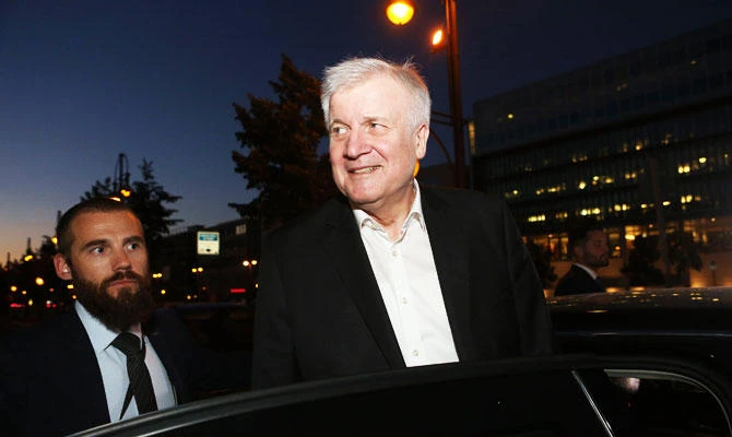 German Interior Minister and leader of the Bavarian Christian Social Union (CSU) Horst Seehofer gets into his car as he leaves the German Christian Democrats (CDU) headquarters after a meeting with the German Chancellor in Berlin on July 2, 2018. (AFP)