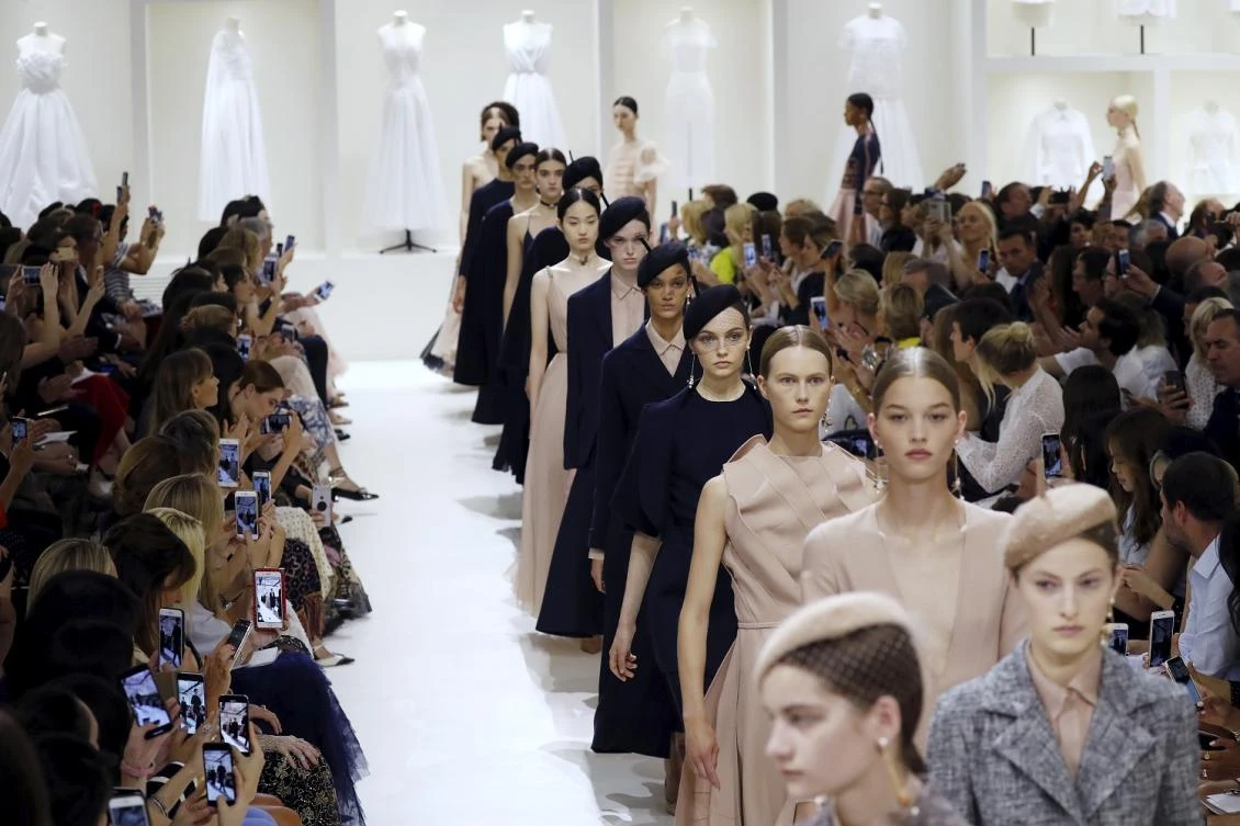 Models present creations by Christian Dior at the end of the 2018-2019 Fall/Winter Haute Couture collection fashion show in Paris, on July 2, 2018. (AFP)