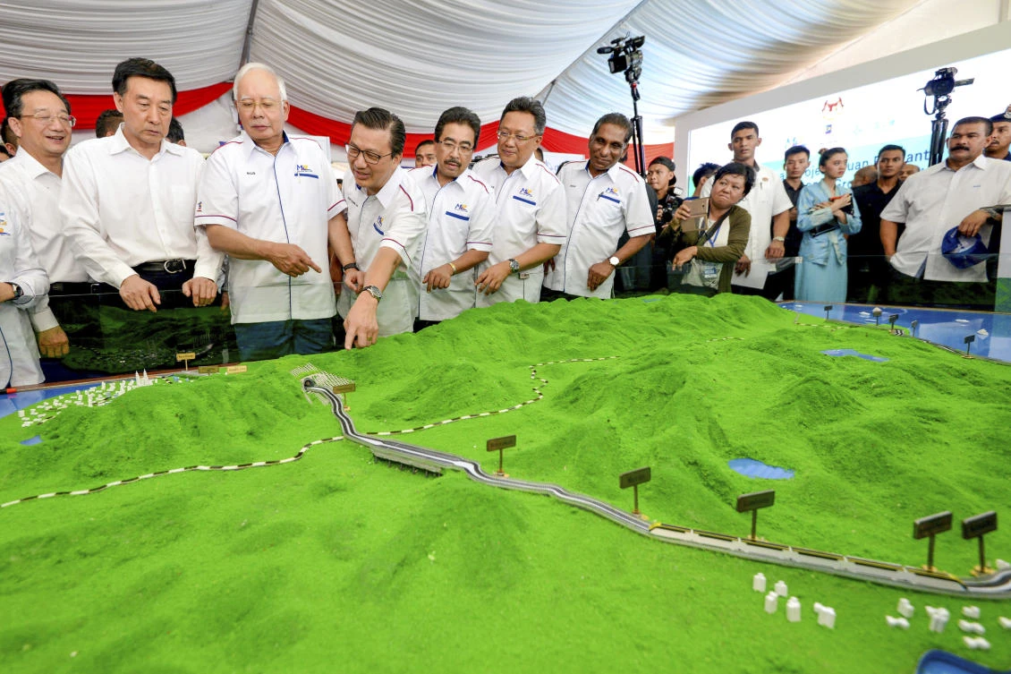 Former Malaysian Prime Minster Najib Razak, third from left, looks at a model of the East Coast Rail Link during its launch in September 2017. (AP)