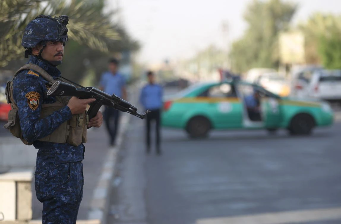 A members of the Iraqi Federal Police patrols the streets of Baghdad’s Shula district, as part of inforced security measures taken by the government following the excecution of 13 death row jihadists on June 29, 2018. (AFP)