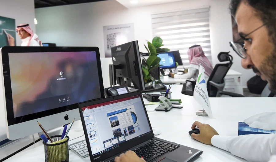 A number of initiatives and programs have been designed to attract more Saudi nationals working outside the Kingdom. (AFP/File)