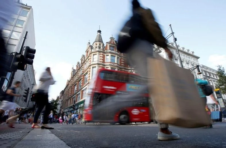 New UK business flowed in at the fastest rate in just over a year, with firms registering a boost to consumer spending from unusually warm weather. (Reuters)