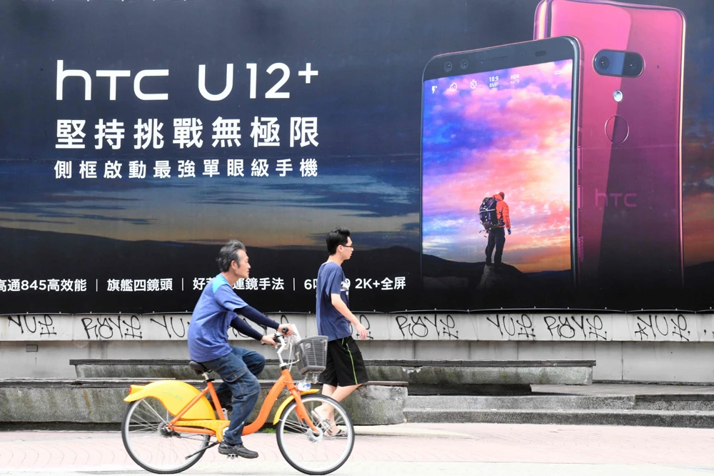 Taiwan’s struggling smartphone maker HTC announced on July 3 it would slash 1,500 jobs, around a fifth of its total workforce, in the biggest staff cull for three years following heavy losses. (AFP)