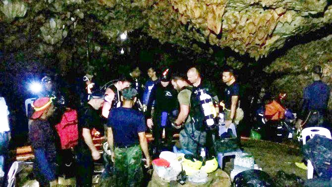 ‘Race against water’ as rain threatens Thai boys in the cave