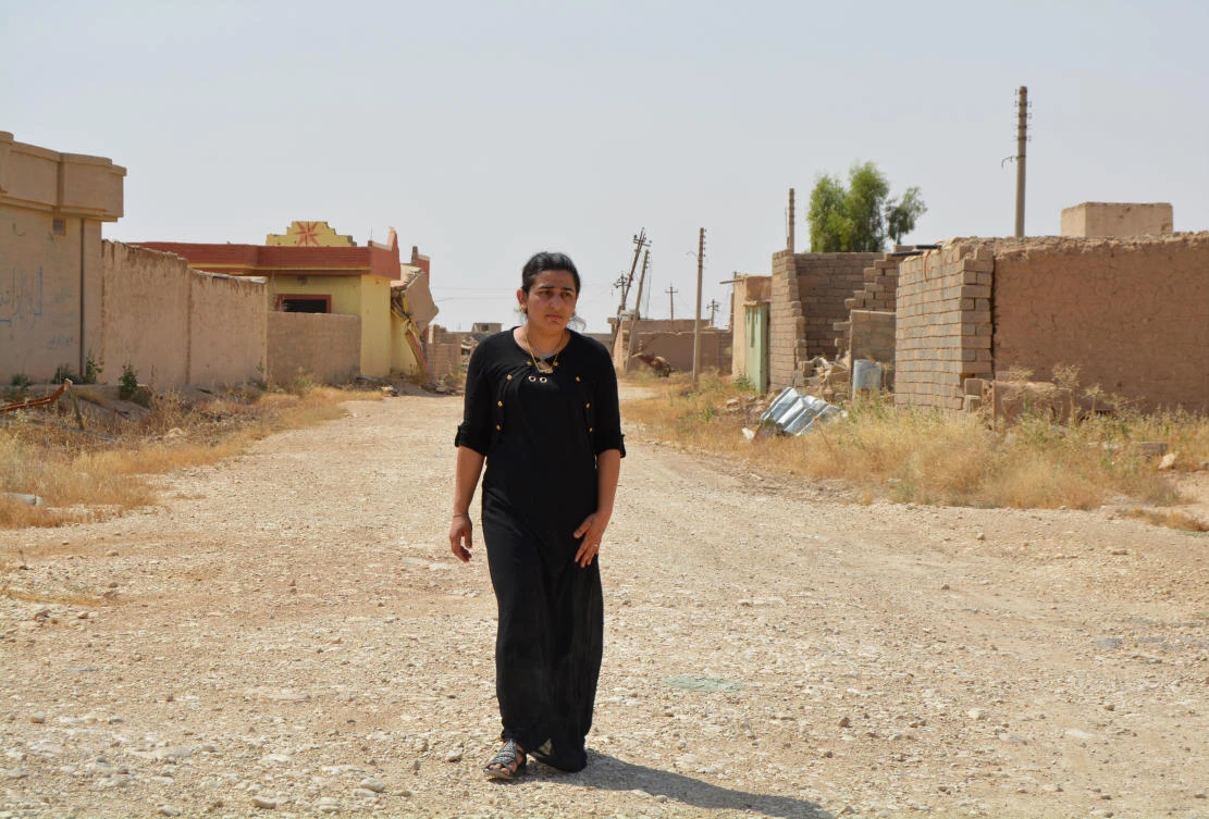 In this Tuesday, July 3, 2018 photo, provided by Yazda, a US-based Yazidi rights group, Farida Khalaf returns to her home village of Kocho, northern Iraq. (AP)