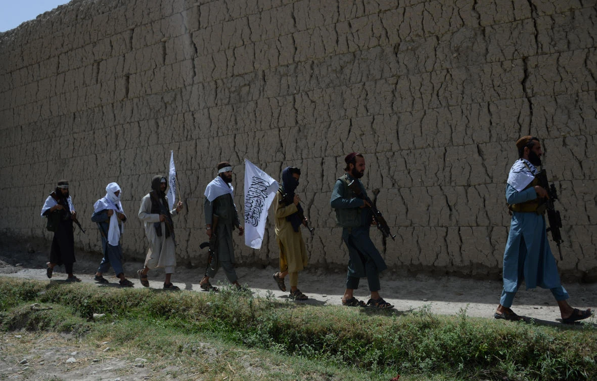 Afghan Taliban militants take to the streets to celebrate a ceasefire on June 16, 2018. (AFP)