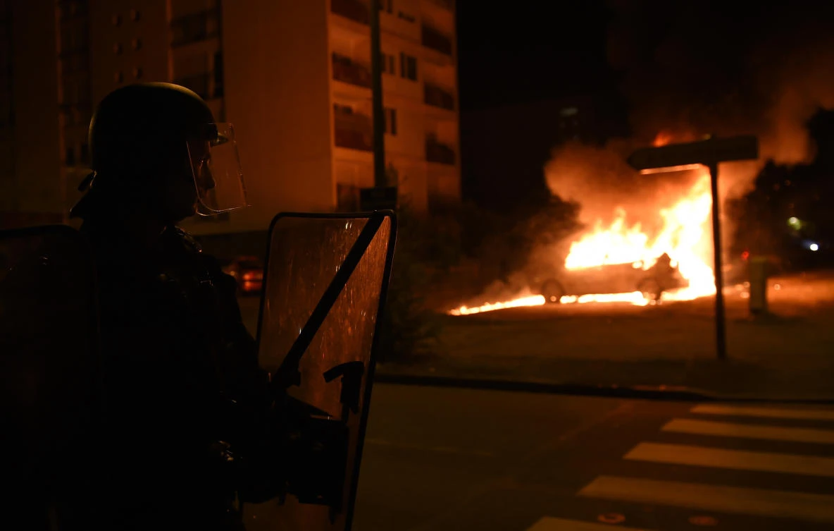 French policeman charged with manslaughter as shooting sparks riots