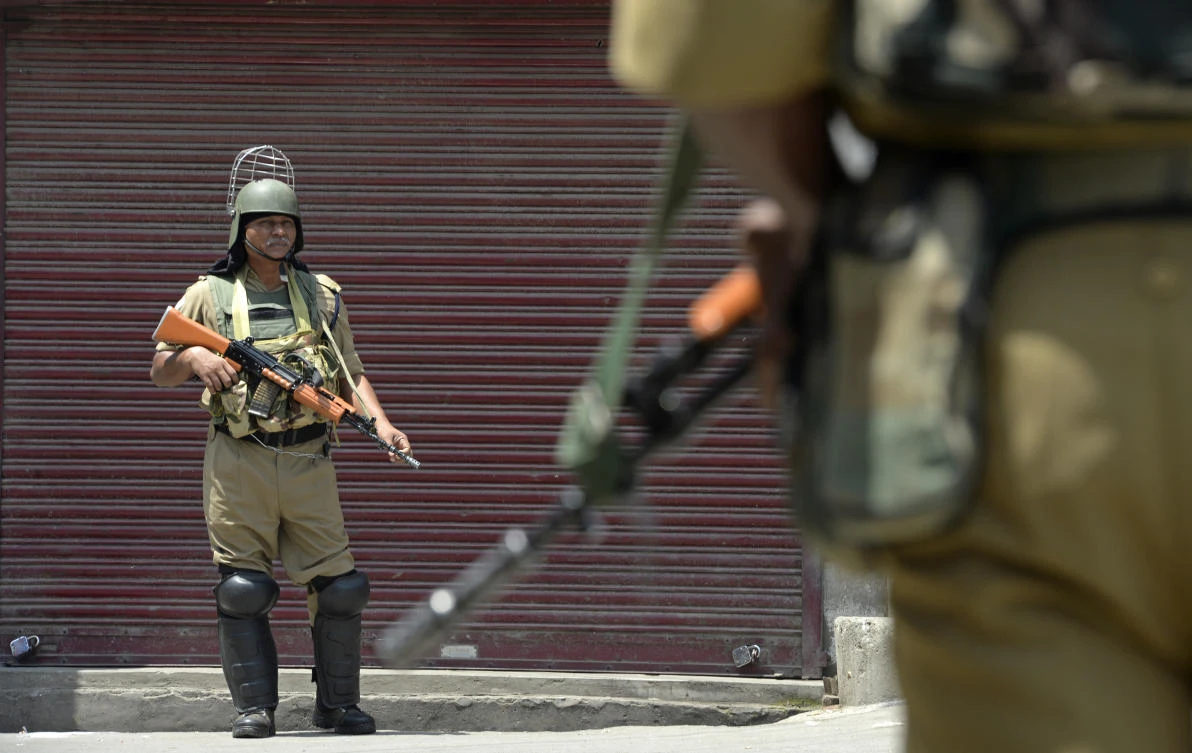 Indian paramilitary troopers stands guard in front of closed shops during a one-day strike in Srinagar on Saturday, July 7. Anti-India sentiment runs deep in Kashmir, a Himalayan territory divided between India and Pakistan but claimed by both in its entirety. (AFP)