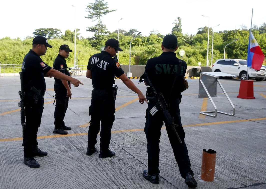 In this July 4, 2018, file photo, Philippine National Police SWAT members check the site where Tanauan city Mayor Antonio Halili was killed during a flag-raising ceremony by an unidentified gunman at the Tanauan City Hall in Tanauan city, Batangas province south of Manila, Philippines. (AP)