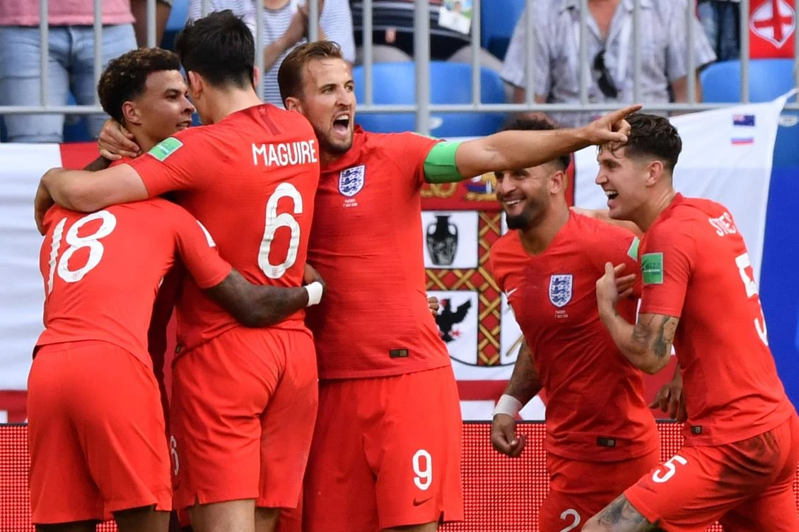 Dele Alli celebrates with his teammates after scoring the match-clinching second goal. (AFP)