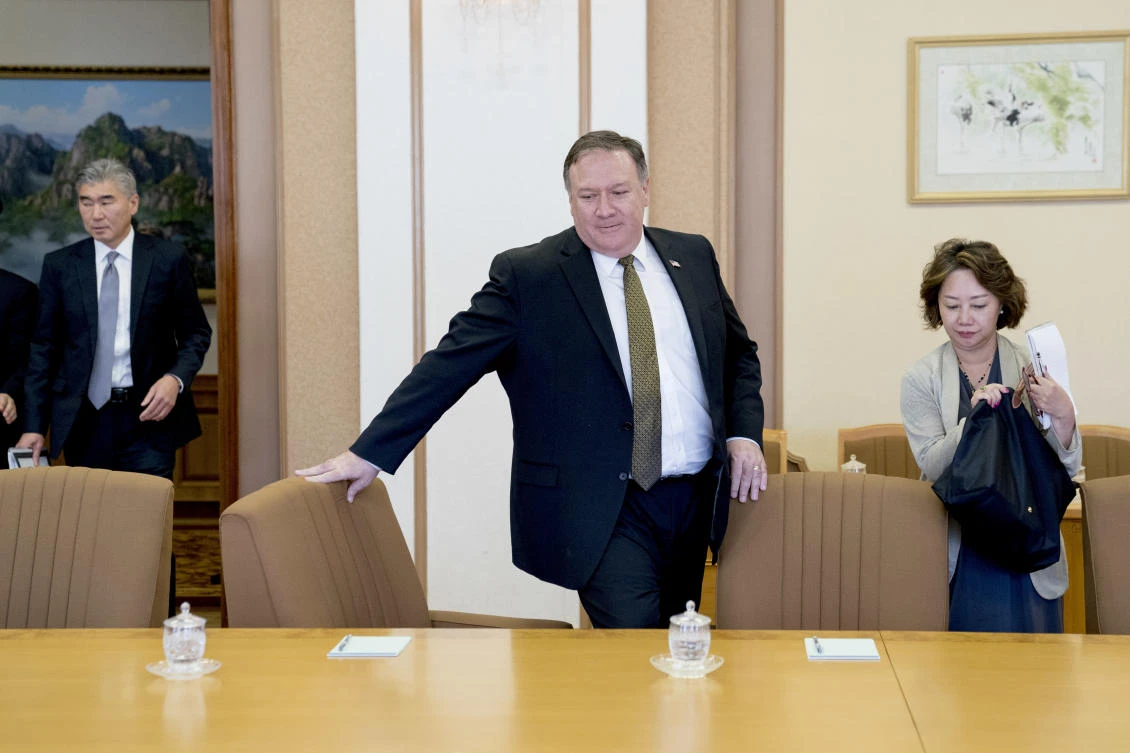 US Secretary of State Mike Pompeo, center, accompanied by US Ambassador to the Philippines Sung Kim, left, and a translator, right, returns from a break during meetings with Kim Yong Chol, a North Korean senior ruling party official and former intelligence chief, at Park Hwa Guest House in Pyongyang, North Korea, on Saturday. (AP)