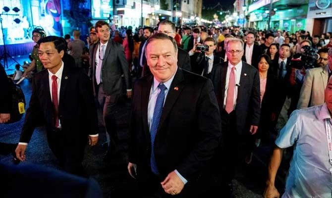 US Secretary of State Mike Pompeo, walks through the streets of Hanoi, Vietnam on Sunday. (Reuters)