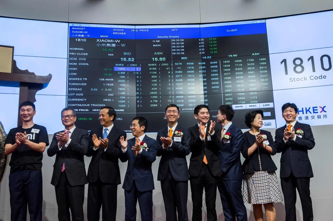 Xiaomi shares are displayed on a screen as they start trading on the Hong Kong Stock Exchange on Monday, July 9. (AFP)