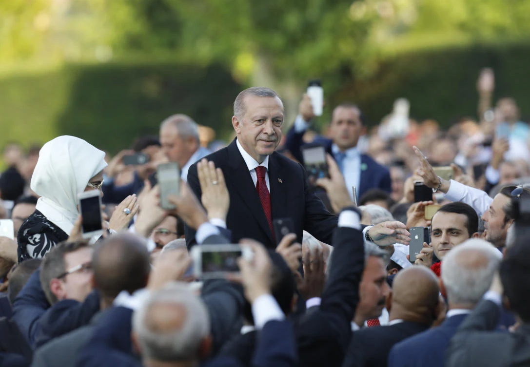 Turkey’s President Recep Tayyip Erdogan salutes supporters as he arrives for a ceremony at the Presidential Palace, in Ankara, Turkey, Monday, July 9, 2018. (AP)