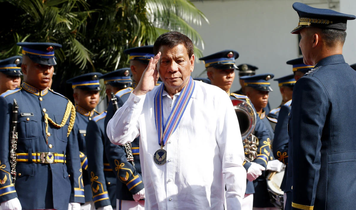 Philippine President Rodrigo Duterte salutes during a wreath-laying ceremony at the 71st Founding Anniversary of the Philippine Air Force at Villamor Air Base in suburban Pasay city south of Manila, Philippines Tuesday, July 3, 2018. (AP)