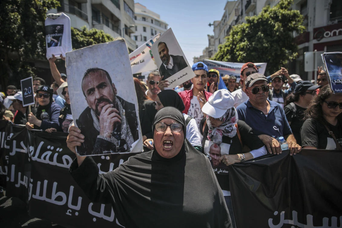 Relatives of Hirak activist Mohammed Jaloul take part in a march denouncing heavy sentences against them, in Casablanca, Morocco, Sunday, July 8, 2018. (AP)