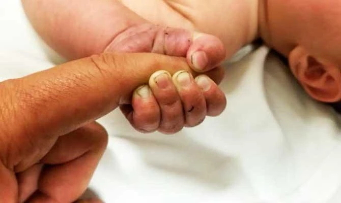 Baby survives 9 hours buried in western Montana woods