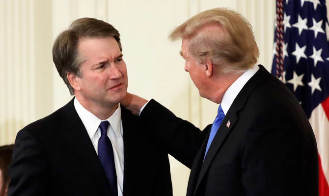 President Donald Trump greets Judge Brett Kavanaugh his Supreme Court nominee, in the East Room of the White House, on Monday in Washington. (AP)