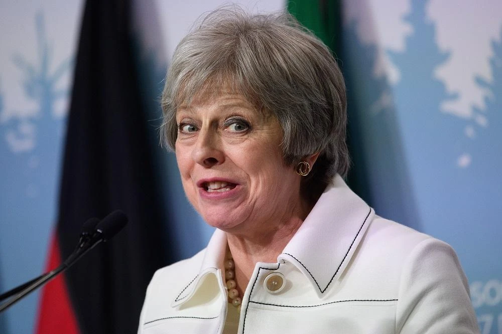 UK PM May seeks unity amid chaos over Brexit plans