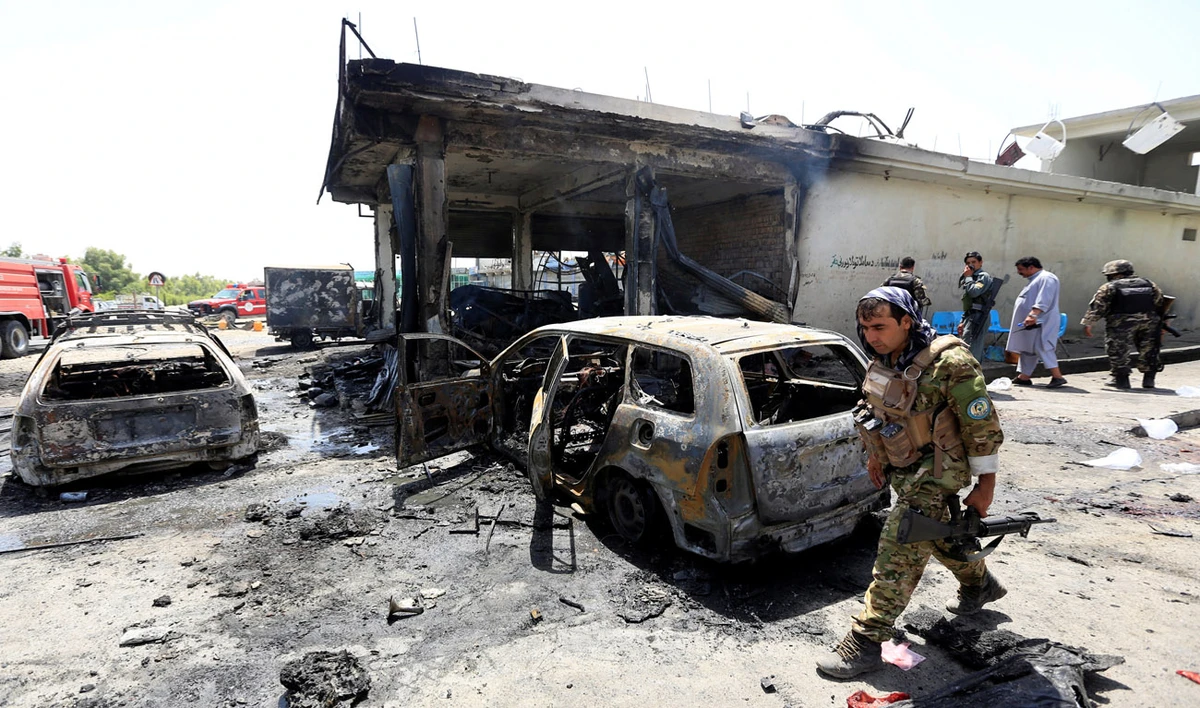 Afghan security forces inspect the site of a suicide attack in Jalalabad city, Afghanistan July 10, 2018. (Reuters)