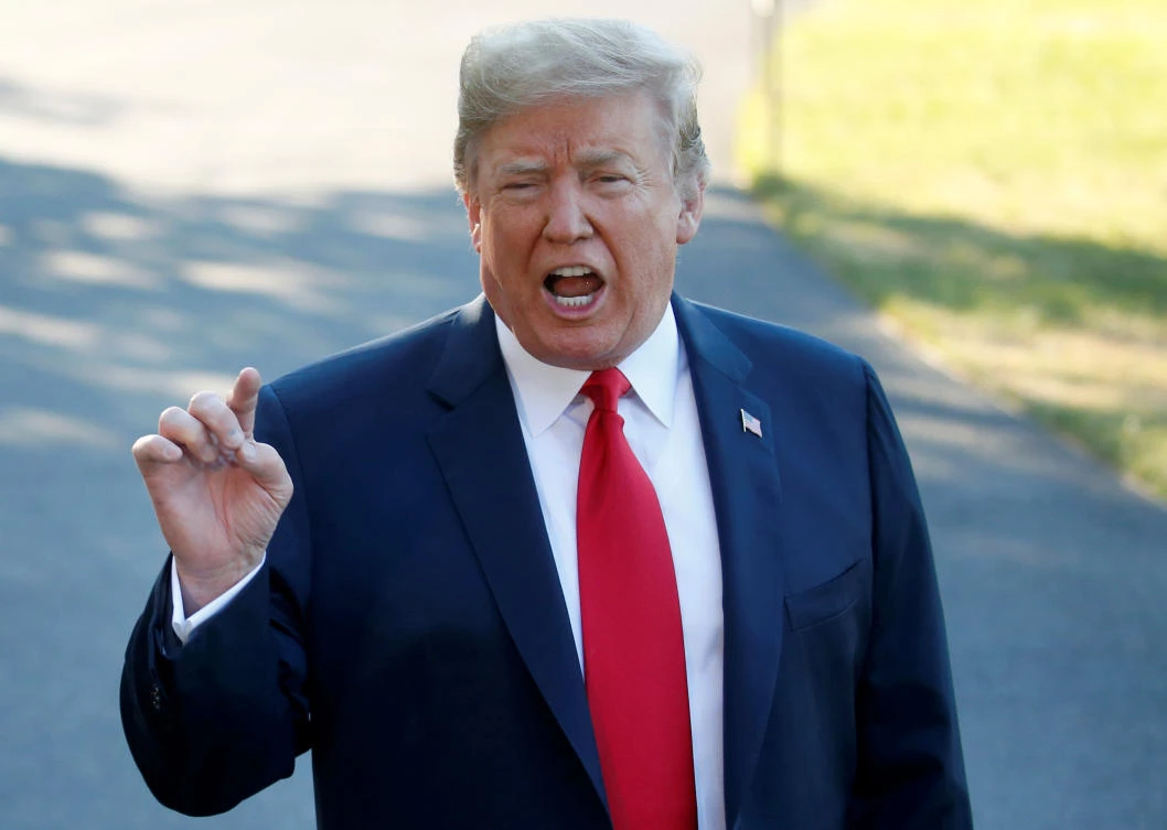 US President Donald Trump speaks with the news media before boarding Marine One for travel to Europe from the White House, in Washington, US, July 10, 2018. (Reuters)