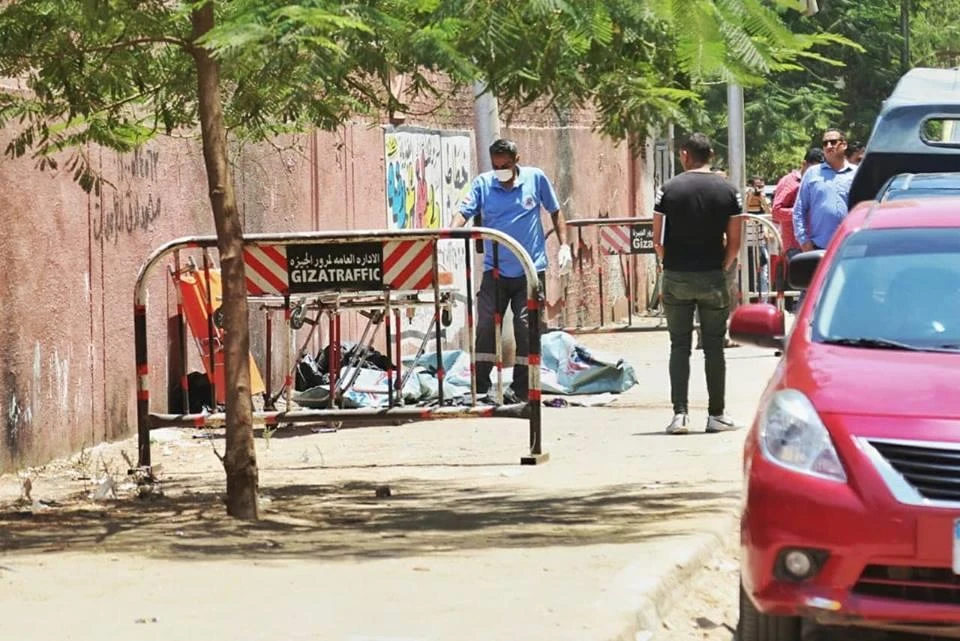 Egyptian police search an area cordoned off following the discovery of the three bodies. (Courtesy Masrawy.com)