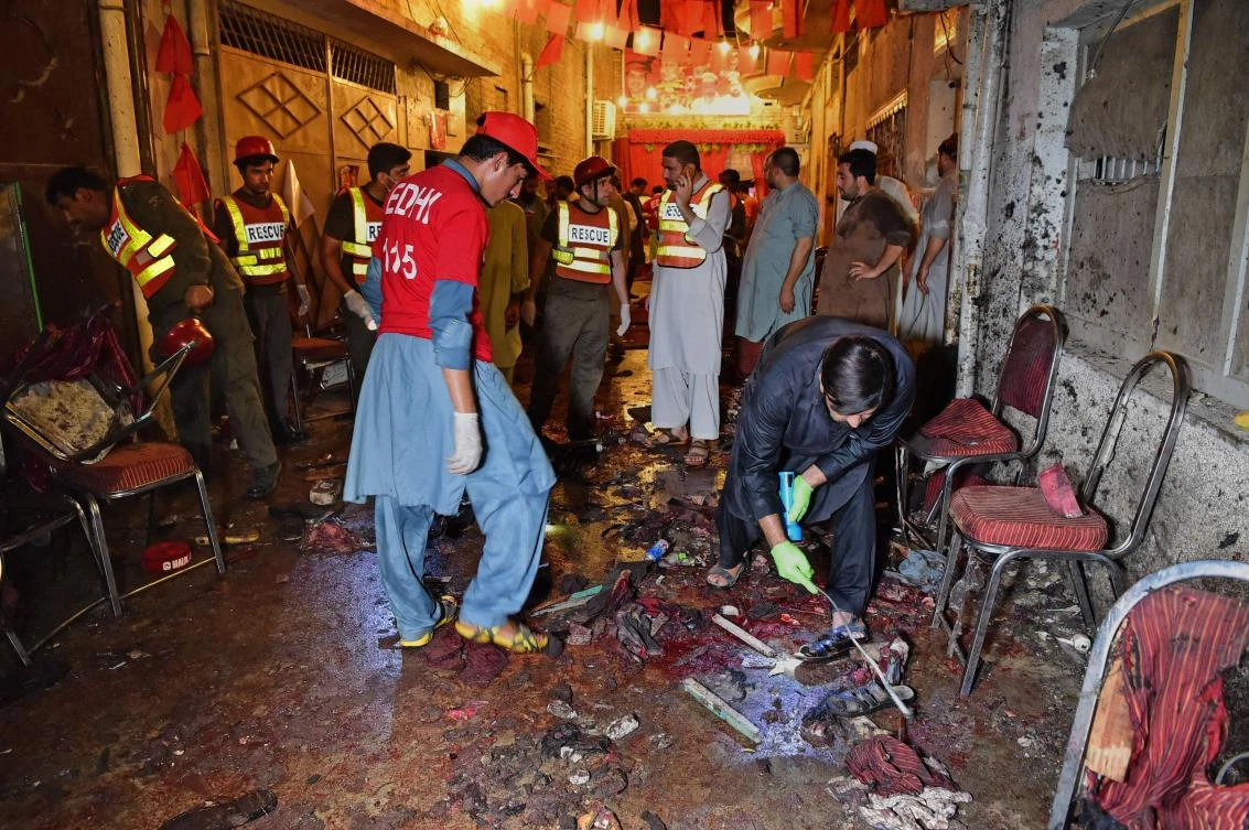 Pakistan election rally suicide bomb toll climbs to 20