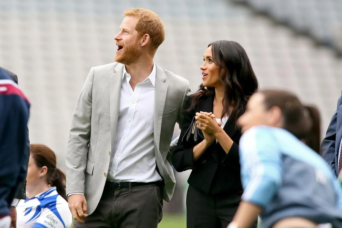 Britain’s Prince Harry, Duke of Sussex (L) Britain’s Meghan, Duchess of Sussex watch a demonstration during a visit to Croke Park, home of the Gaelic football association in Dublin on the final day of their two day visit on July 11, 2018. (AFP)