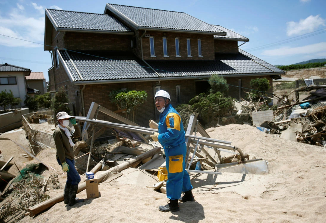 Daily temperatures above 30 Celsius and high humidity in the aftermath of the flood is taking a toll on residents and rescue workers in Japan. (Reuters)