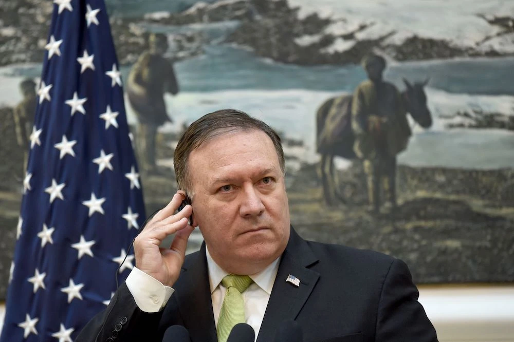 In this file photo, US Secretary of State Mike Pompeo looks on as he listens to Afghan President Ashraf Ghani during a press conference at the Presidential Palace in Kabul on July 9, 2018. (AFP)